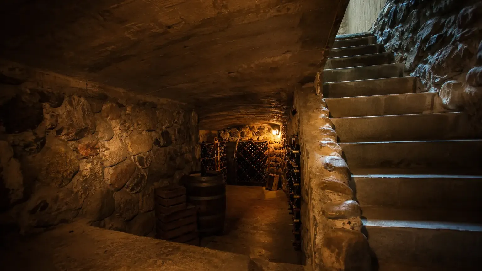 Subterranean stone cellar with a staircase descending