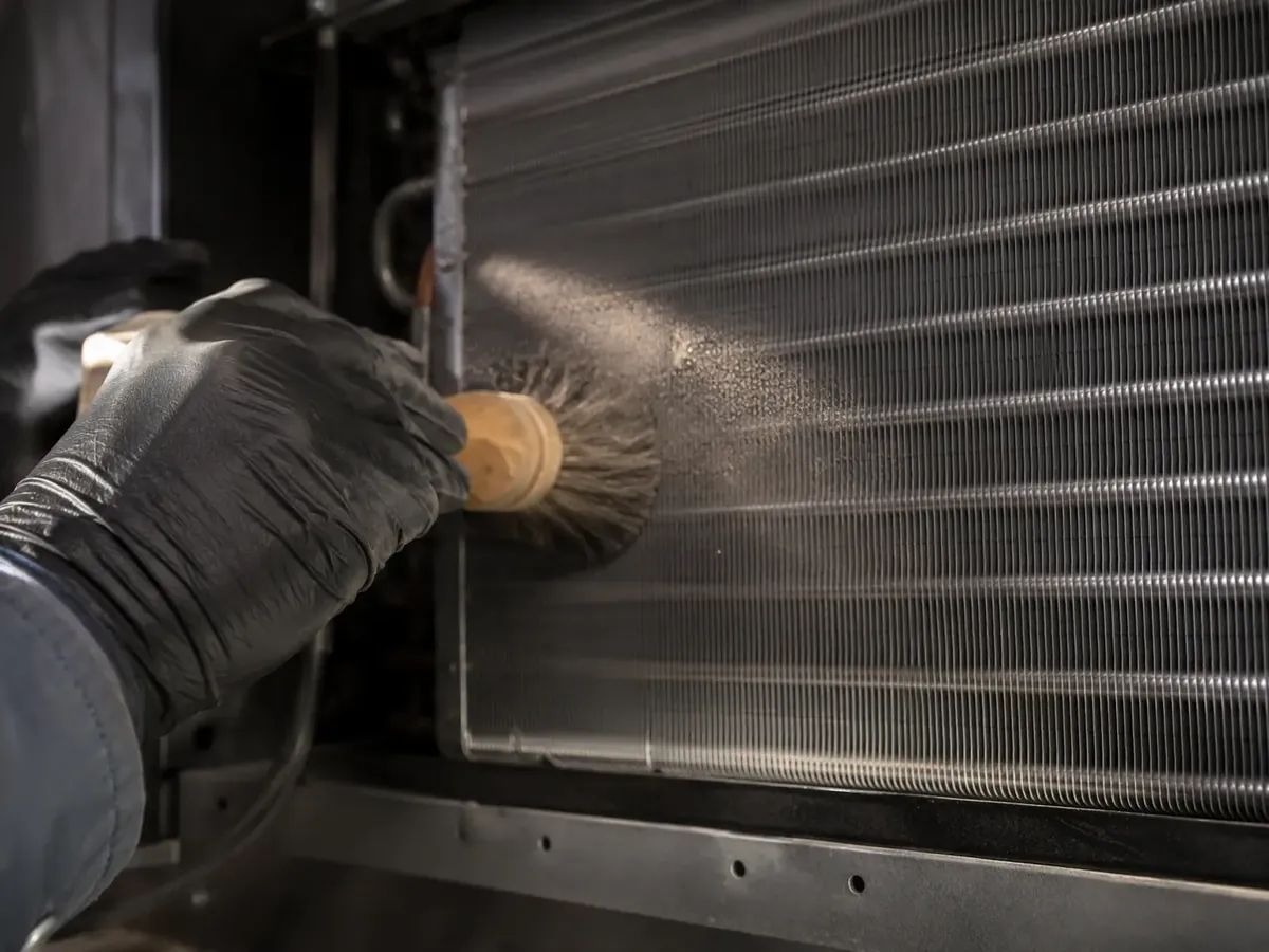 Cleaning condenser coil fins on a cellar cooling unit